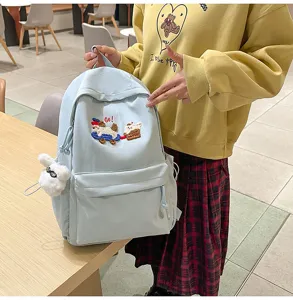 Casual light blue school backpack for students, large capacity daily casual campus bag with cute pendant.