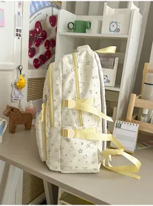 Canvas schoolrugzak met leuke sterrenprint, gele banden en een zeer grote capaciteit.