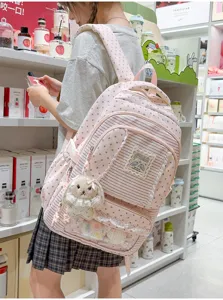 Roze sterren streep schoolrugzak met schattige kanten afwerking en pluche konijntje.