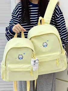 Leuke gele canvas rugzak set voor school en reizen met schattig katten borduurwerk.