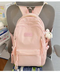 Leuke roze schoolrugzak voor meisjes en studenten met strik borduursel en grote capaciteit.
