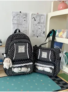 Leuke zwarte schoolrugzak met sterrenprint en bijpassende tote bag voor studenten.