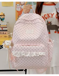Leuke roze polkadot schoolrugzak met kanten afwerking, lichte casual dagrugzak voor meisjes.