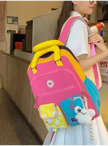 Kleurrijke dopamine kleurenblok dames rugzak stijlvolle schooltas met schattige pluche hanger.