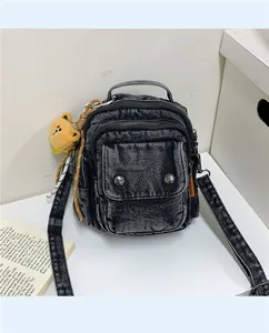 Vintage black denim backpack and crossbody bag with cute bear pendant for women casual daily.