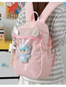 Roze sterren rugzak met schattige engelenvleugels en doorzichtige voorzak voor schoolgebruik.
