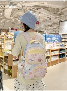 Leuke pastel schoolrugzak voor meisjes met grote capaciteit, meerdere vakken en schattige hangers.
