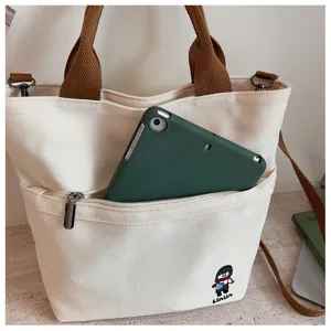 Sac cabas en toile de style coréen avec bandoulière et poche zippée pour le quotidien.