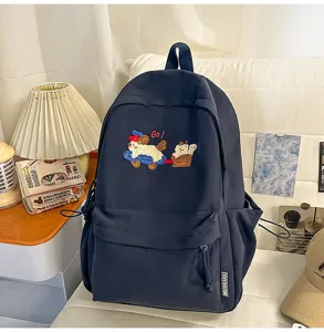 Stylish dark blue campus backpack with cute dog embroidery and large capacity for students.