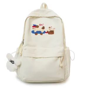 Casual white canvas backpack for women with cute dog embroidery and plush charm main view.