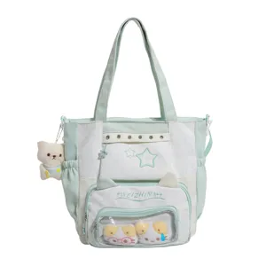 Leuke mintgroene ita-tas met doorzichtig voorvak, sterrenborduurwerk und grote opbergruimte.