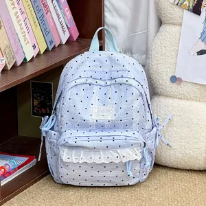 Lichtblauwe polkadot kant rugzak, schattige studenten schooltas met volants en strikken.