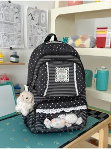Gedetailleerd uitzicht op schattige zwart-witte sterrenschoolrugzak met doorzichtige zak.