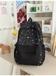 Koreaanse stijl zwarte rugzak met schattige witte strikken en harten voor studenten en meiden.