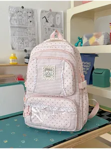 Roze sterren streep schoolrugzak met doorzichtige zak en kantafwerking, gedetailleerd zicht.