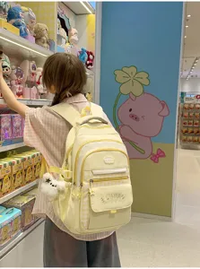 Koreaanse geruite schoolrugzak met meerdere vakken en een schattige hanger voor meisjes.