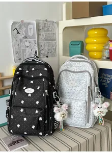 Leuke polkadot rugzak voor meisjes schoolrugzak casual dagrugzak met kawaii pluche hanger