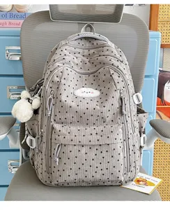 Schattige corduroy schoolrugzak met sterrenpatronen en wolkborduurwerkdetail voor dagelijks gebruik.