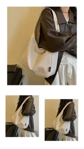Detailaufnahme der Stoff-Umhängetasche am Model, die Fassungsvermögen und Design betont.