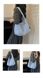 Zustandsbezogene hellblaue Canvas-Umhängetasche für Damen, schlichte Pendler-Tragetasche.
