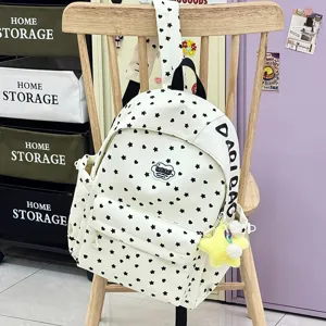 Canvas studenten rugzak met zwarte sterren print, grote capaciteit casual tas detail view.