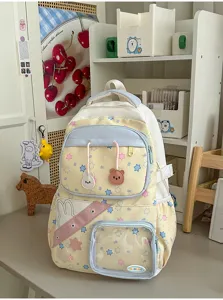 Pastelkleurige schoolrugzak met sterrenpatroon, grote capaciteit en schattige berenhangers.