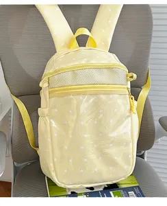 Leuke gele rugzak met sterrenprint, doorzichtig vak en mesh details voor schoolmeisjes.