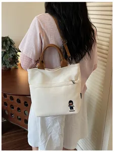 Sac à bandoulière en toile épaissie style coréen pour femmes travail et école quotidienne.