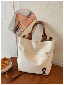 Sac cabas en toile épaisse style coréen avec poche zippée et anses marron pour le quotidien.