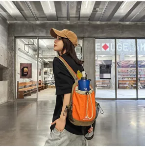 Mochila ligera con cordón para exteriores, bolso bandolera bicolor para deporte y viaje.