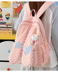 Sweet pink polka dot backpack with cute bunny ears, lace trim and star heart patches for daily use.