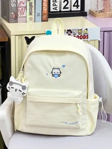 Crèmekleurige canvas schoolrugzak met kattenborduurwerk en grote capaciteit voor dagelijks gebruik.