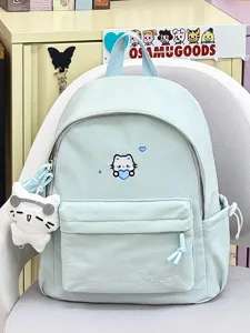 Lichtgroene canvas rugzak detail met schattig geborduurd kattenontwerp en voorzak.