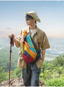Outdoor multi-color patchwork foldable backpack detail view for hiking, travel and sports use.