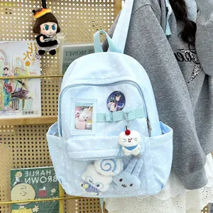 Zaino azzurro chiaro con motivo a stelle e finestra trasparente per spille e peluche