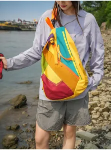 Colorful color-block sling backpack, outdoor travel daypack with adjustable straps and mesh pocket.