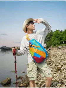 Outdoor colorful patchwork sling bag, portable chest pack for hiking, running, and travel use.