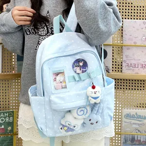 Zaino ita a pois blu dolce con finestra trasparente, simpatici peluche anime e spilla.