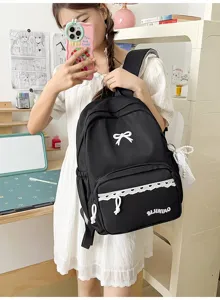 Stijlvolle Japanse zwarte rugzak met schattige witte strik en kantrand, studententas.
