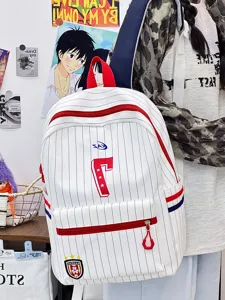 Close-up detail of the Japanese style white pinstripe backpack with red zippers and number 7 patch.