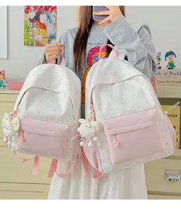 Leuke roze gestreepte rugzak, grote capaciteit lichte schooltas met schattige konijnenhanger.