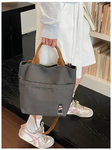 Sac cabas en toile style coréen pour femme, sac porté épaule décontracté avec anses marron.