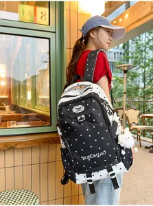 Sac à dos décontracté noir et blanc avec motif étoiles pour étudiants, grand voyage.