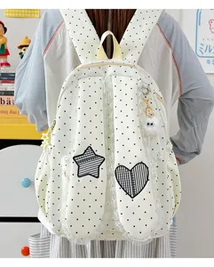 Sweet polka dot bunny ear backpack with lace trim, ideal student school bag and casual daypack.