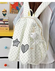 Cute polka dot bunny ear backpack detail shot showing sweet lace trim and star heart design.