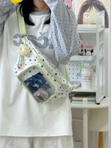Sac ita en toile avec fenêtre transparente, motif étoile et bretelles vert pastel.