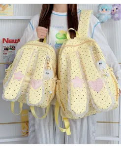 Sweet polka dot backpack detail showing lace trim, cute bunny ears, and star heart patches.