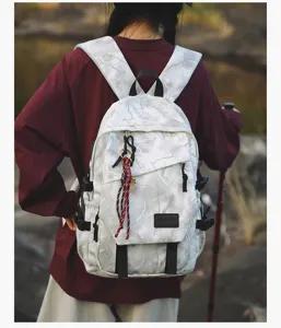 Sac a dos scolaire motif marbre avec grande capacite et poches multiples pour etudiants.