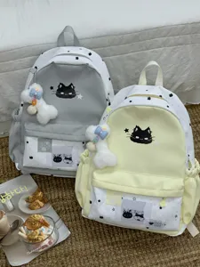 Leuke esthetische sterren print canvas schoolrugzak met zwarte kat borduursel en pluche pop.