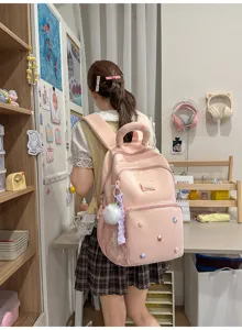 Roze schattige schoolrugzak voor tiener meisjes grote capaciteit casual boekentas met pompon.
